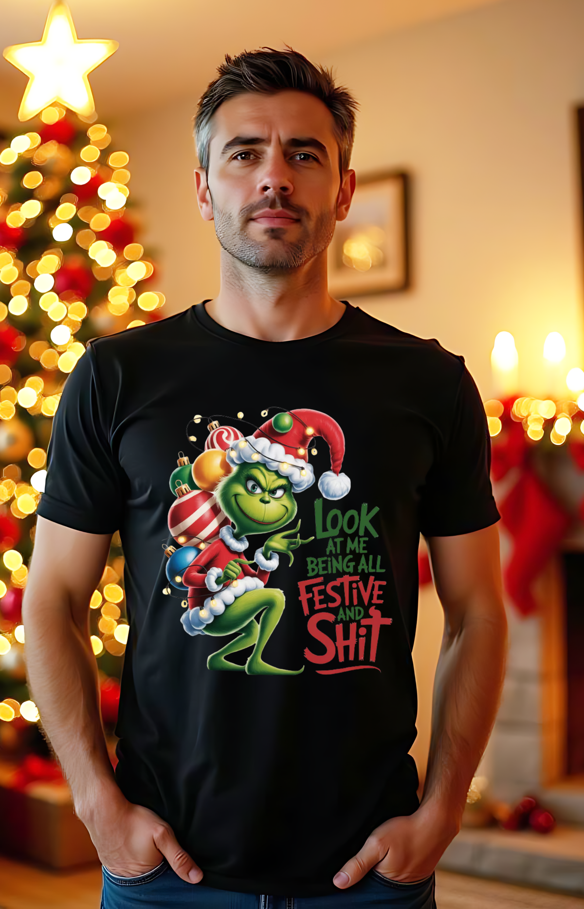 Model wearing a black Christmas T-shirt with a Grinch graphic and festive slogan